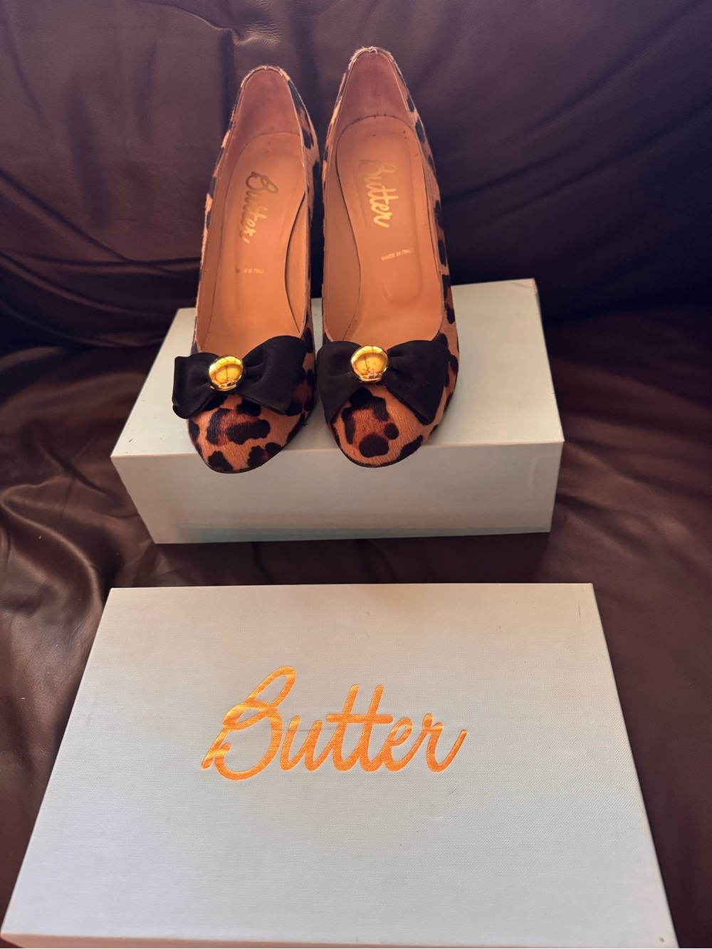 Butter “Sofie” Leopard-Print Pointed Pumps with Black Bow & Gold Button